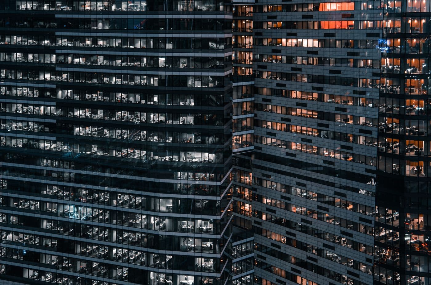Apartment buildings lit up in the evening in Varachha, Surat