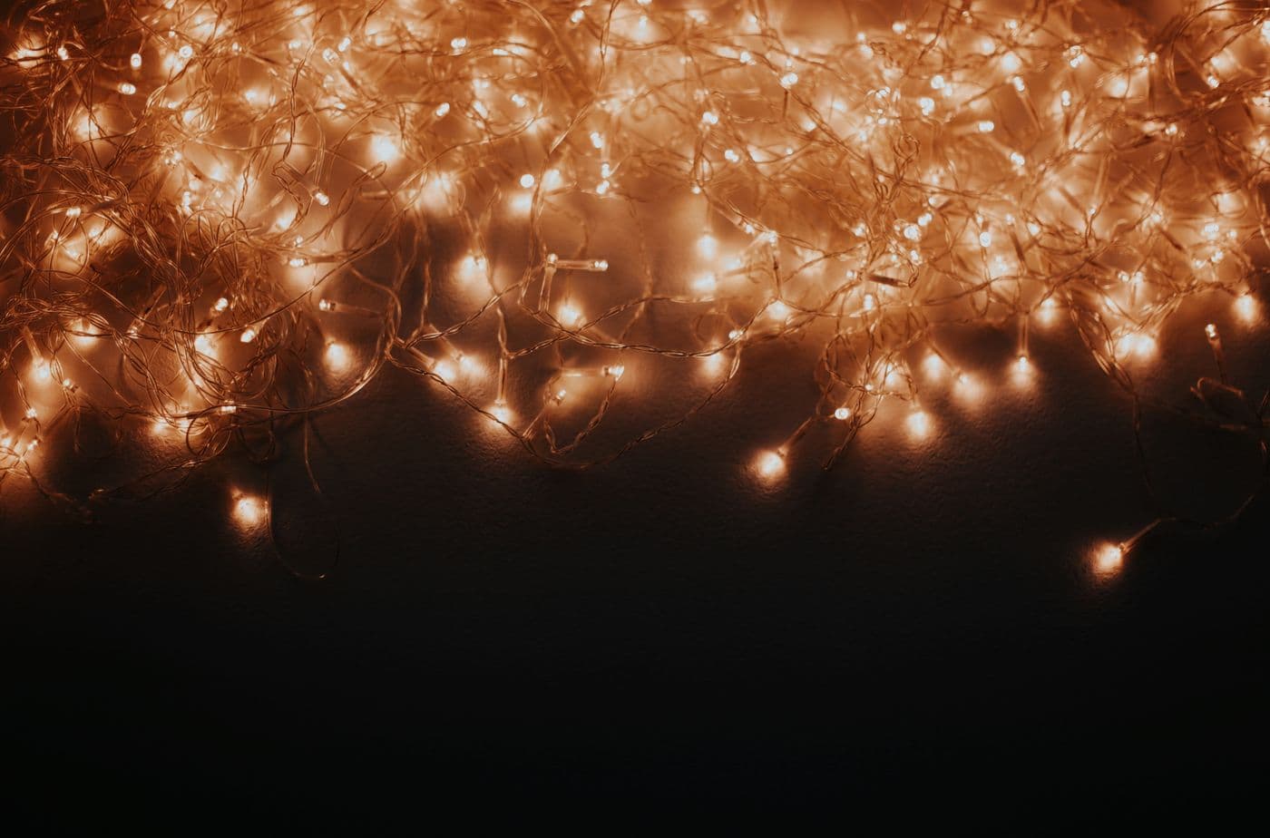 Soft bokeh from warm decorative string lights at night