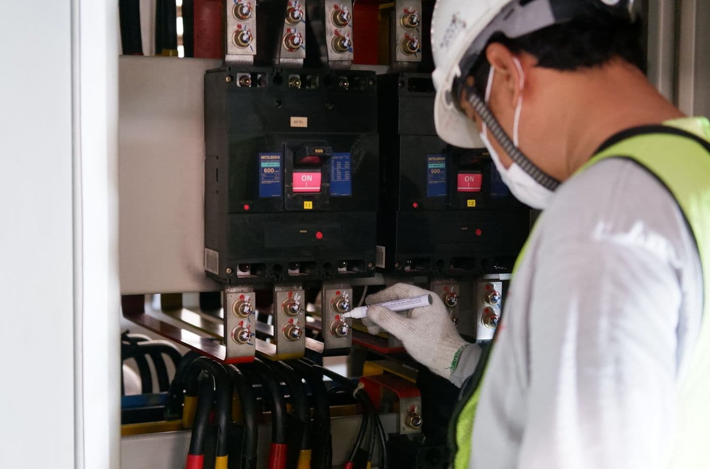 Technician carrying out a safety inspection on a residential electrical panel