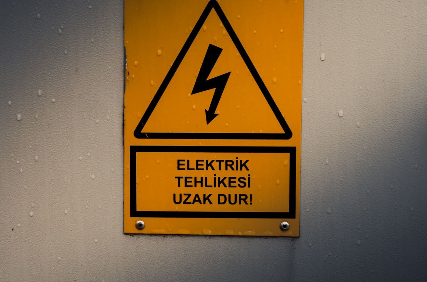 Yellow electrical hazard warning sign with a lightning bolt symbol